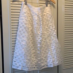 White Jcrew pleated eyelet skirt.